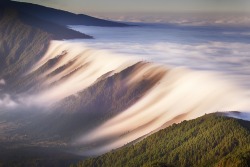 somme:  Clouds flowing over a mountain range on La Palma Island,