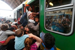 by http://america.aljazeera.com/articles/2015/9/3/confusion-and-chaos-as-refugees-pour-into-budapest-train-station.html