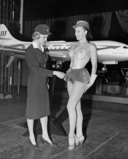 SAS stewardess Birgitta Lindman examines a showgirl’s costume