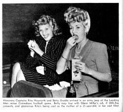 doomsdaypicnic:  Rita Hayworth enjoys a snack with Betty Grable