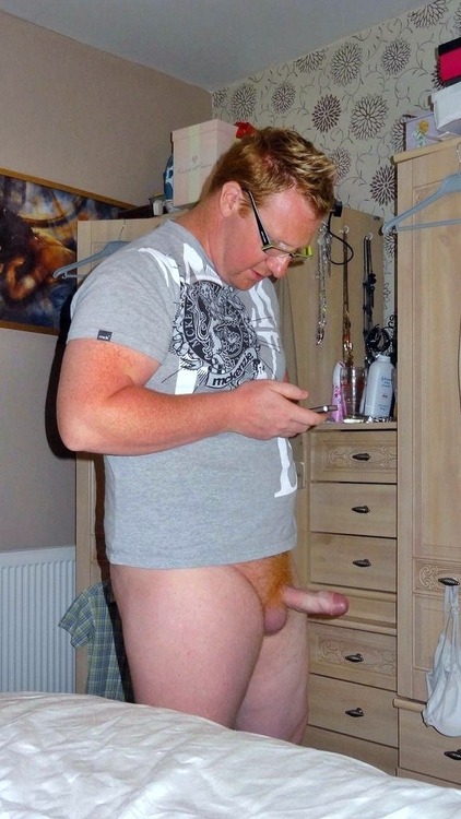 mykindofhotmen:  Check out this sexy ginger daddy taking a hard dick selfie while someone takes a full-length pic of him. Â Yum. 