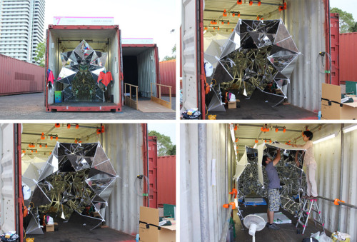 exhibition-ism:  Installation by designers Â Masakazu Shirane   Saya Miyazaki entitled â€˜Winkâ€™ invites visitors to enter the life size kaleidoscope built inside of a 40 ft long shipping container.Â  