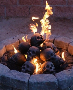 sixpenceee:   Life size human skull fireplace logs  