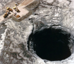 politics-war:  In June of 1994, a huge hole, 106 ft. wide by