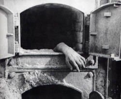 An unburned hand emerging from an oven serves as a stark reminder