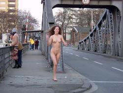 Municipal streaking on bridge in city.Â   streakers:  Streaking