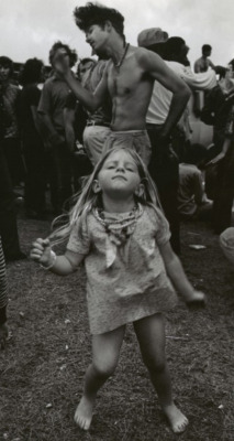  A young Hippie girl dancing at a festival in New Orleans, Louisiana,
