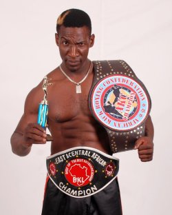 thelandofwtf:  PsBattle: Ronald Mugula with a trophy and big