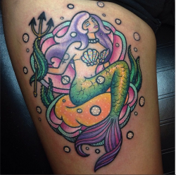 fuckyeahtattoos:  Feminist Mermaid on my thigh, done by Kelly