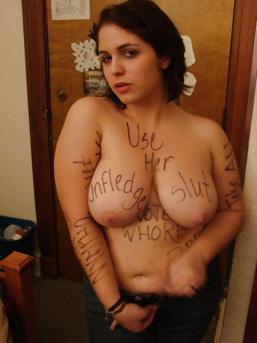 Lots of nice words there, and many I can’t make out. If anyone ever sees more of this shoot, let us know! Use Her. Unfledged slut. Whore. Take All. Nympho.