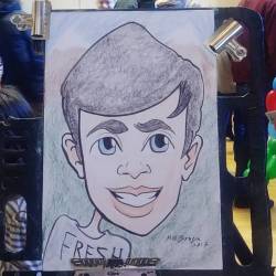 Doing caricatures at the Melrose Farmer’s Market at Memorial