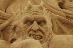 sixpenceee:  These Dante’s Inferno sand sculptures are from