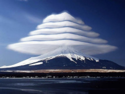  Lenticular clouds over Mount Fuji, Japan. These are stationary