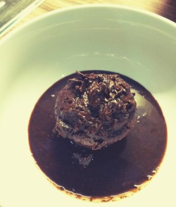 Double chocolate muffin served with homemade dark chocolate syrup