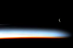 spaceexp:  Stunning sunset with crescent Moon from the ISS, photographed