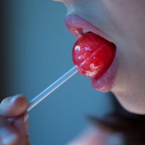 Emma twirled the Tootsie-Pop just inside her mouth. After a minute,