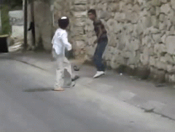 nowinexile:  Two Israeli settlers attack a Palestinian kid in