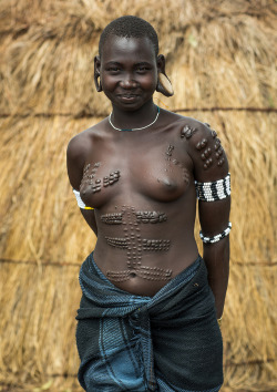 Mursi tribe woman with breast scarifications, Omo valley, Mago