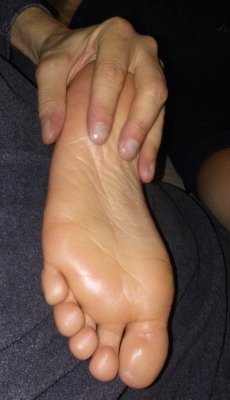 Rubbing lotion on a girlfriend’s feet and enjoying an oberon!