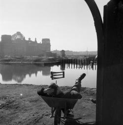  Werner Bischof Berlin, a worker relaxing in front of the Reichstag.