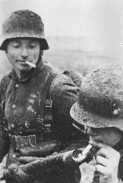 historicaltimes:  Soldier lights his cigarette with a flamethrower