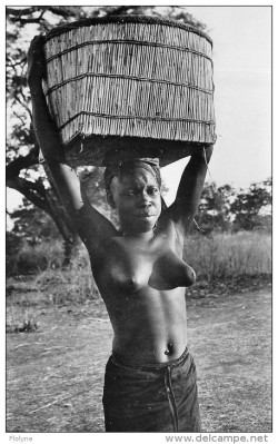   Burkinabe woman, via Delcampe.   