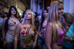 Topless and body painted at a Brazilian carnival, by sicilia