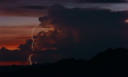 nicleister:  A rotating thunderstorm lights up the Sonoran Dusk.