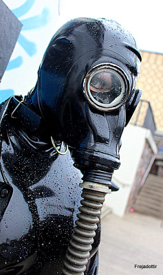 thefrejadottir:  Full enclosure with gasmask in the rain - public