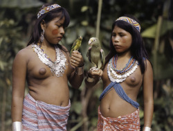 unrar:  Girls of the Choco tribe wear Colombian silver coin necklaces,