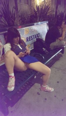 carelessinpublic:  In a short skirt in a bus stand and showing