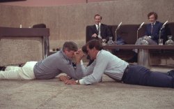   British actor Oliver Reed arm wrestles with Australian actor