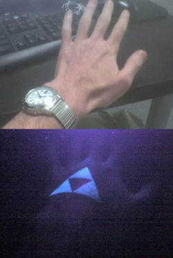 zeldatopia:  This is a triforce tattoo that glows in the dark!