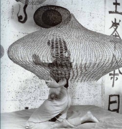 furtho:  Ruth Asawa working on a wire sculpture in her studio,