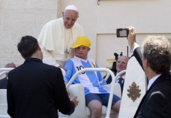The pope let a young guy with down syndrome take his seat in