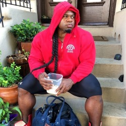 Kai Greene waiting for the bus before his first training session