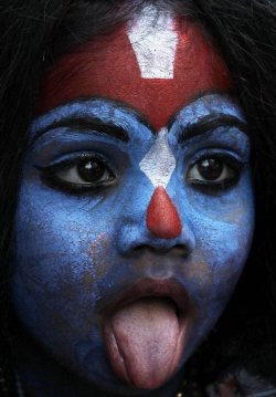 mortem-et-necromantia:  A young girl dresses as Hindu goddess