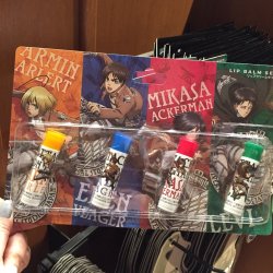 Armin, Eren, Mikasa, and Levi lip balm being sold at Universal