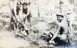 Igorot cooking dog. Bontoc, Mountain Province. Circa 1910-1920.