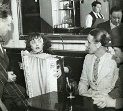 frenchvintagegallery:   Edith Piaf in a Parisian cafe, ca. 1936.