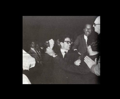 Pier Paolo Pasolini punches a young fascist in front of the cinema