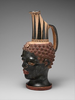afro-textured-art: An Etruscan terracotta vase in the form of
