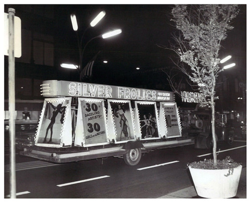 Vintage press photo dated from 1962 features a truck pulling an elaborate trailer ad thru the streets of Chicago, promoting the ‘SILVER FROLICS’ nightclub; located on 400 N. Wabash Avenue..