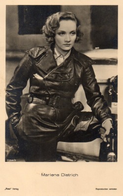 Marlene Dietrich wearing a fetishable leather coat and acting