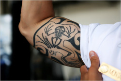 Te skeletal frog tattoo is the design for fallen Navy Seals.