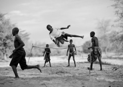 africanstories:Mukubal Kids Doing High Jumping, Virie Area, Angola