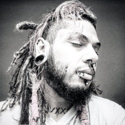 LOSt in my own world.    #dreads #tattoos #piercings  #animallover