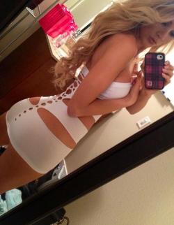 cute blonde chick in perverse very sexy tight white dress selfshot