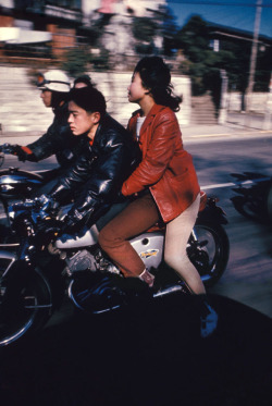 s-h-o-w-a:A group of bikers ride through the streets of Tokyo,