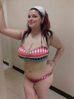 Chubby cutie trying on a colorful bikini